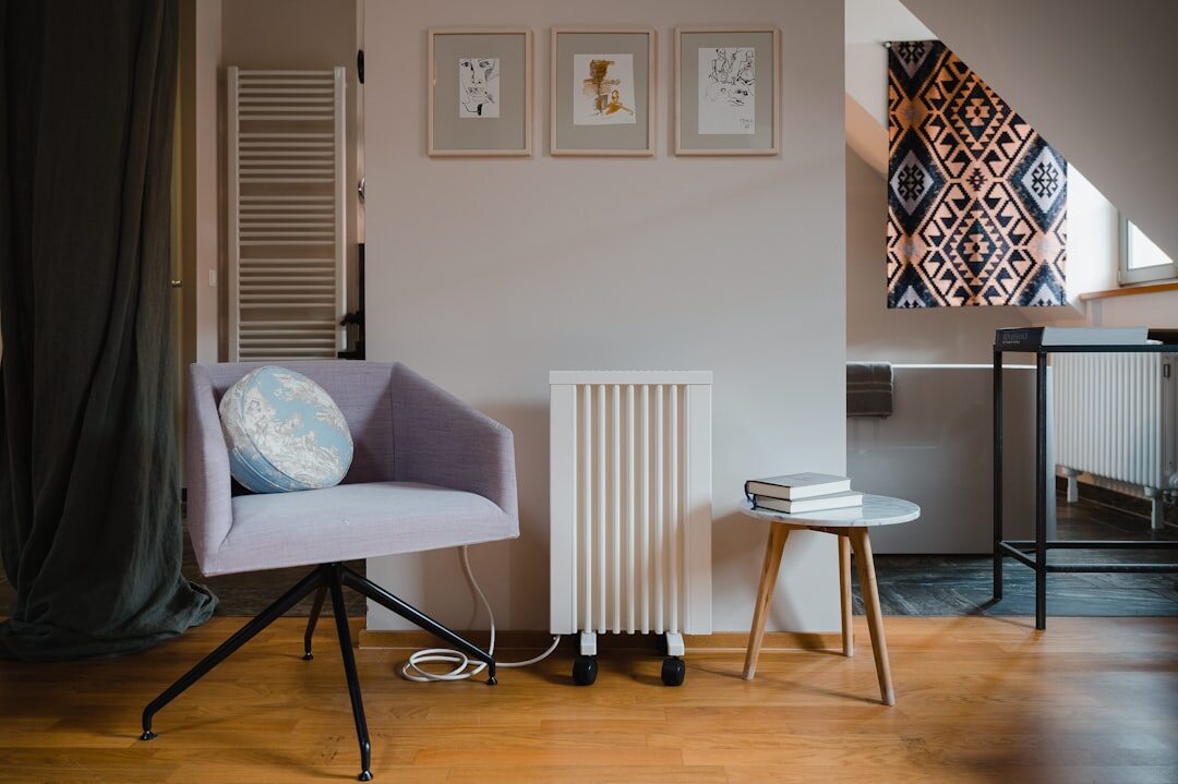 Cozy reading corner with armchair and stacked books